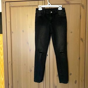 Boys Shein stretchy jeans with destressed areas on knees